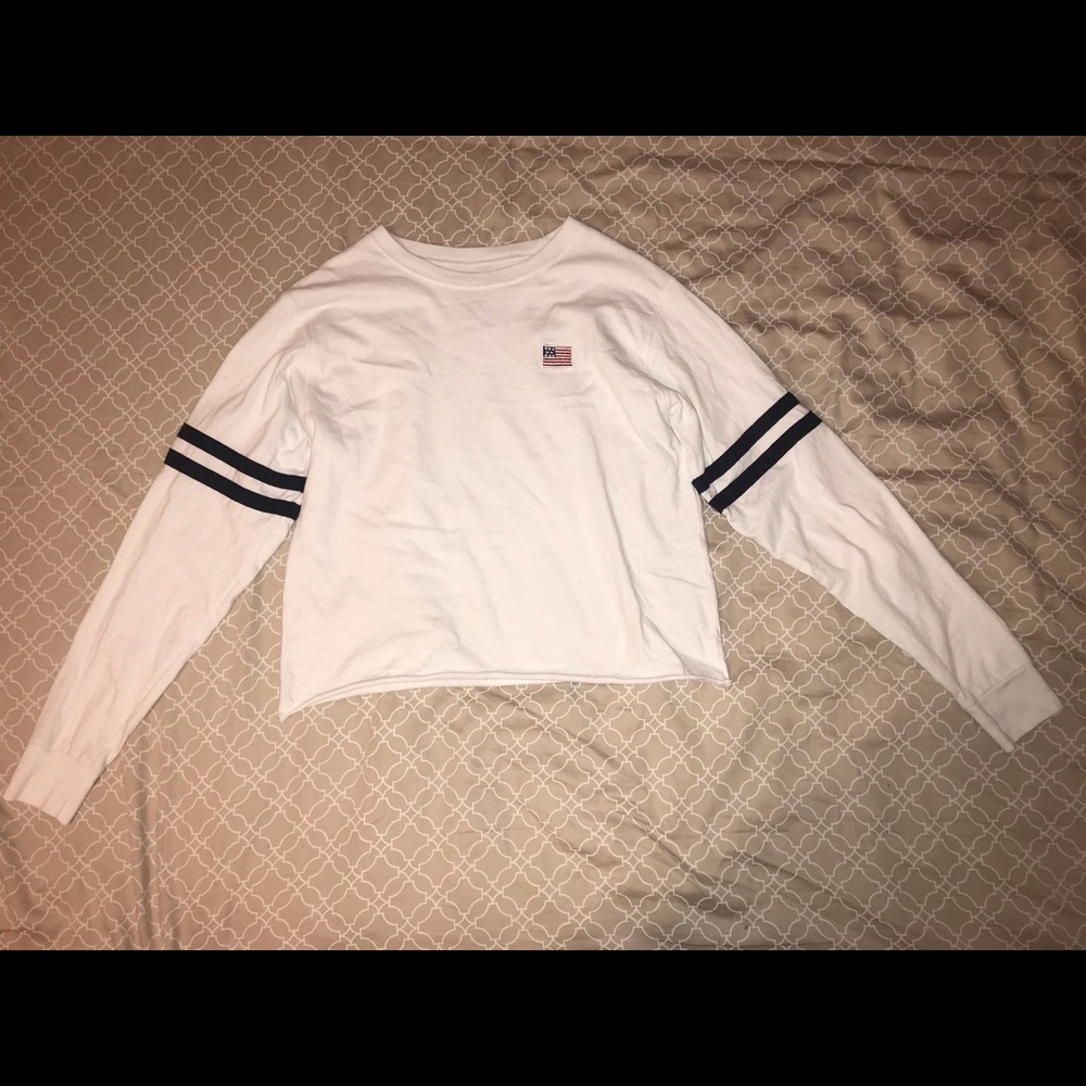 A White cropped long sleeved tee shirt from PacSun